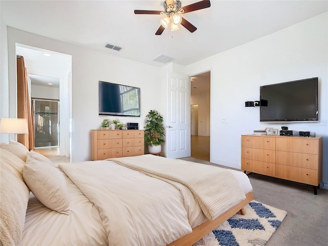 bedroom with connected bathroom and ceiling fan