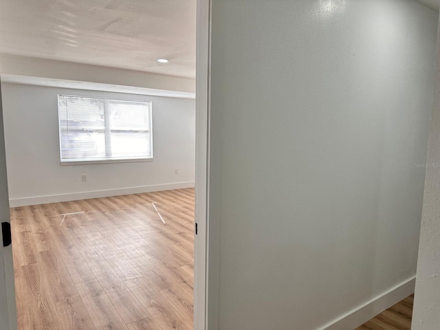 spare room with light wood-type flooring