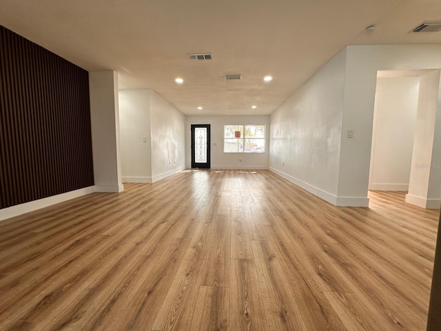 unfurnished living room with light wood-type flooring