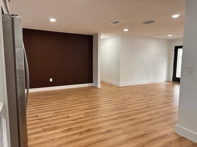 empty room with light hardwood / wood-style floors