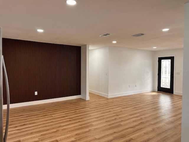 spare room with light hardwood / wood-style flooring