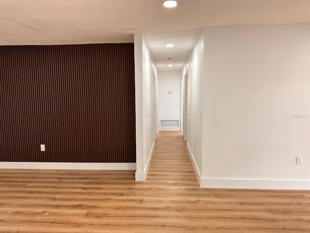 hall with light wood-type flooring