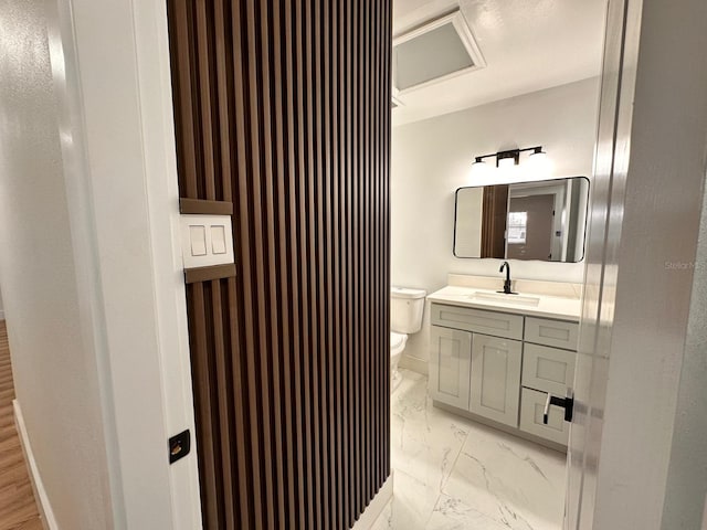 bathroom with vanity and toilet