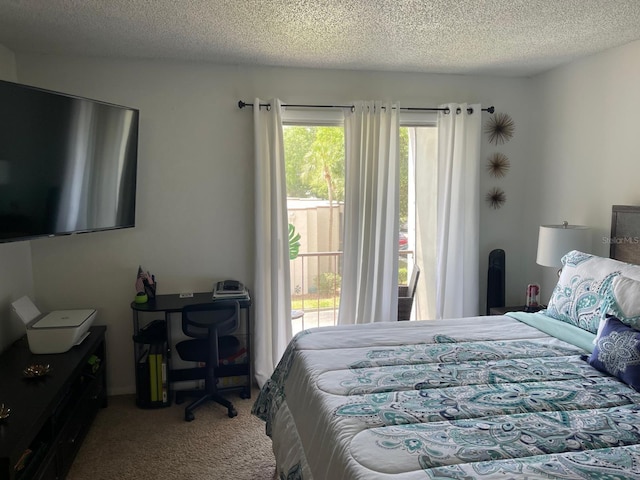 carpeted bedroom featuring a textured ceiling