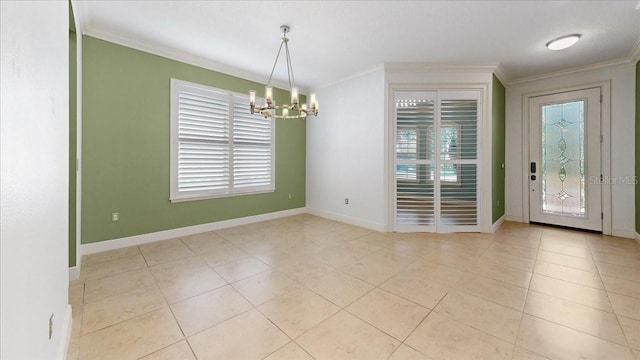 tiled foyer entrance featuring crown molding and a chandelier