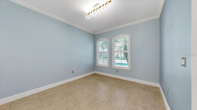 empty room featuring a textured ceiling and crown molding