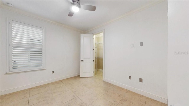 empty room with ceiling fan and ornamental molding