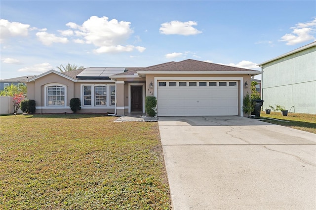 622 Parakeet Ct, Kissimmee, FL 34759 - view of front facade featuring solar panels, a garage, and a front yard