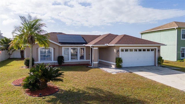 view of front facade featuring a front yard, solar panels, and a garage