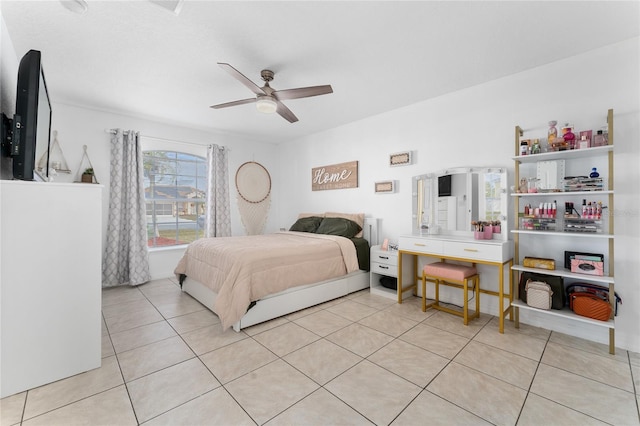 tiled bedroom featuring ceiling fan