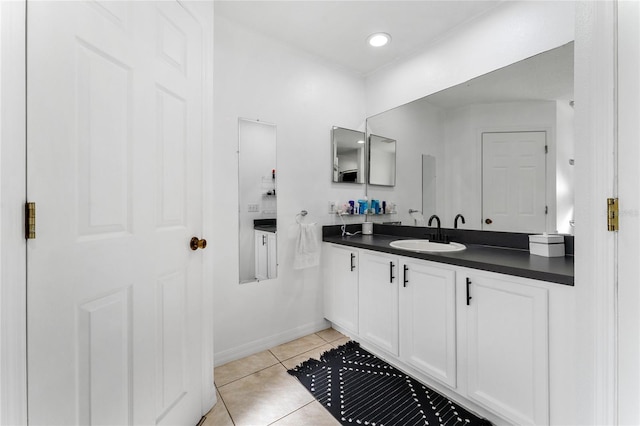 bathroom featuring tile patterned flooring and vanity