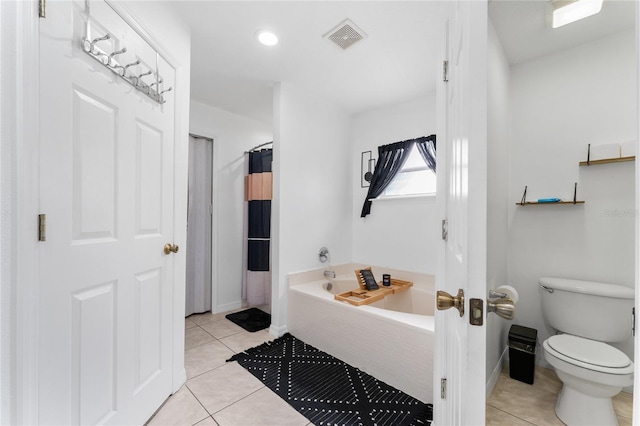 bathroom featuring tile patterned flooring, toilet, and plus walk in shower