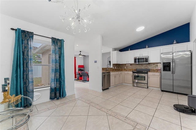 kitchen featuring white cabinetry, decorative light fixtures, light tile patterned flooring, ceiling fan with notable chandelier, and appliances with stainless steel finishes