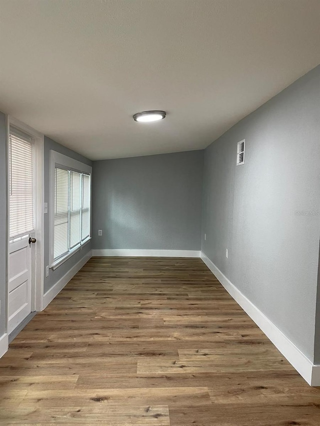 empty room with light wood-type flooring