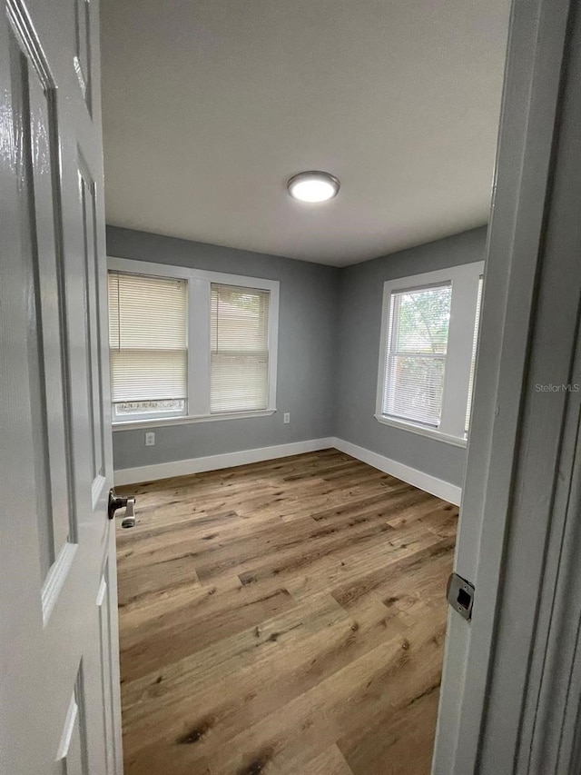 spare room with light wood-type flooring