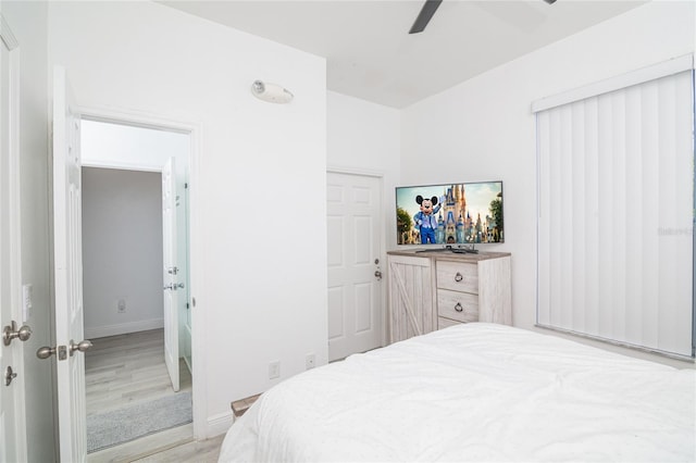 bedroom with ceiling fan and light wood-type flooring