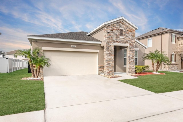 view of front facade featuring a garage and a front lawn