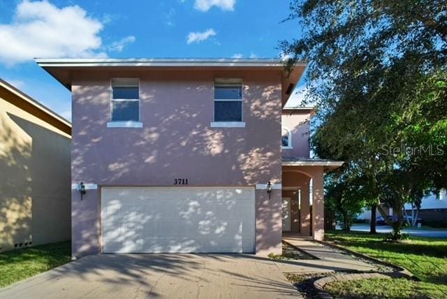 view of property featuring a garage