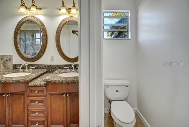 bathroom with vanity and toilet