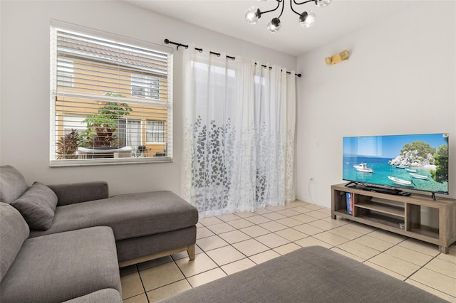 tiled living room with an inviting chandelier