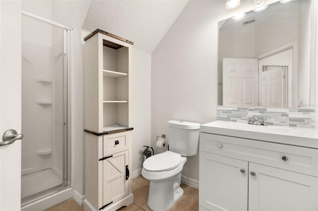 bathroom featuring tasteful backsplash, tile patterned floors, walk in shower, vaulted ceiling, and toilet