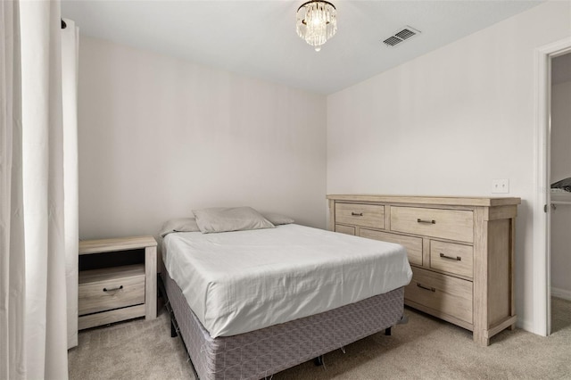 bedroom featuring light carpet