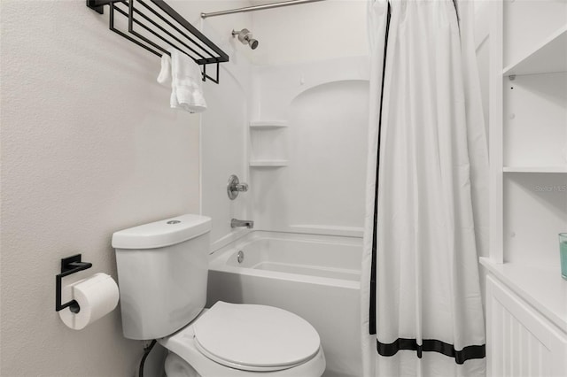 bathroom with toilet and shower / bath combo with shower curtain