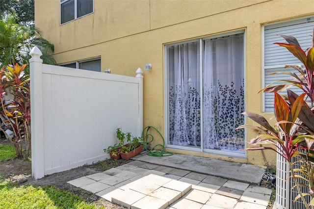 entrance to property featuring a patio area