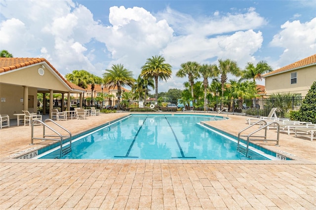 view of swimming pool with a patio area