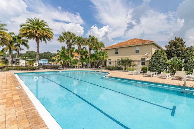 view of swimming pool featuring a patio area