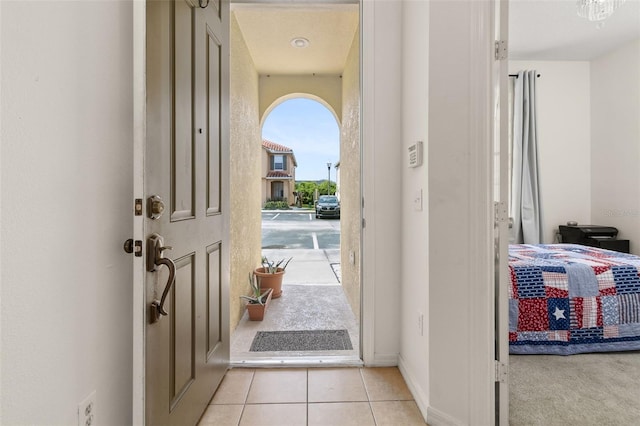 entryway featuring light tile patterned floors