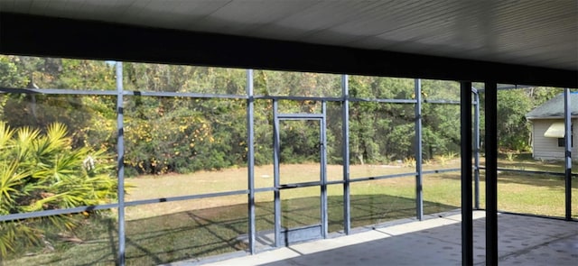 unfurnished sunroom featuring a healthy amount of sunlight