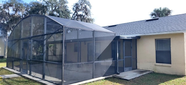 view of home's exterior with a lanai