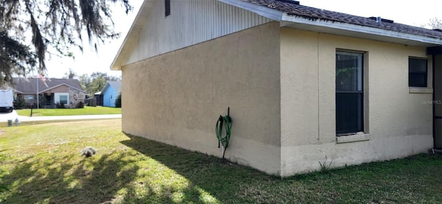 view of property exterior featuring a yard