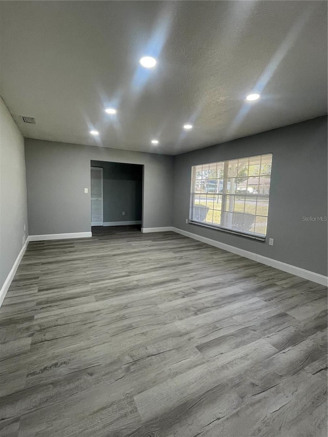 unfurnished room with light hardwood / wood-style flooring