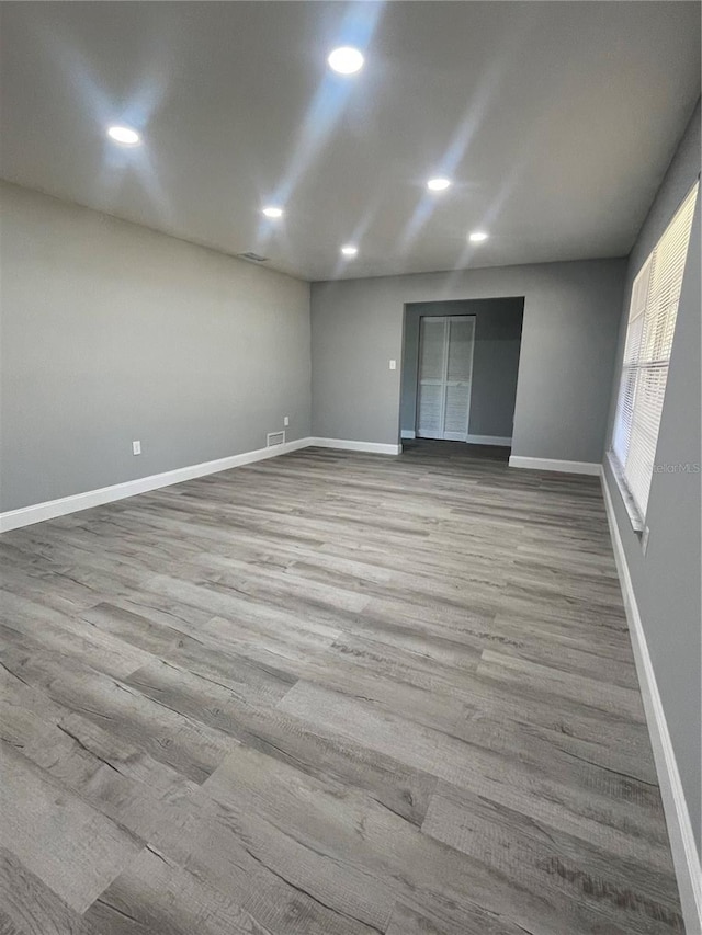 spare room featuring light hardwood / wood-style flooring