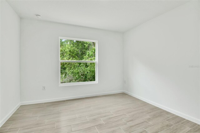 314A Dagama Ct, Kissimmee, FL 34758 - unfurnished room featuring baseboards and wood finish floors