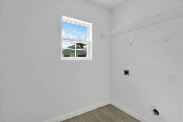 314A Dagama Ct, Kissimmee, FL 34758 - washroom featuring baseboards, electric dryer hookup, laundry area, and wood finished floors