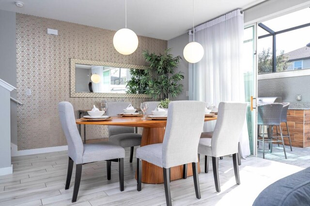 dining area with light hardwood / wood-style floors