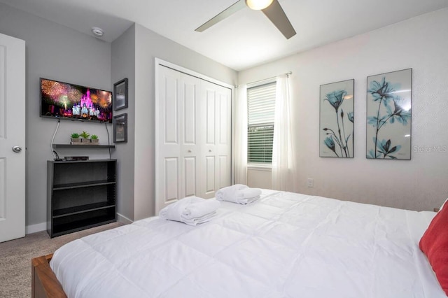 bedroom with carpet floors, a closet, and ceiling fan