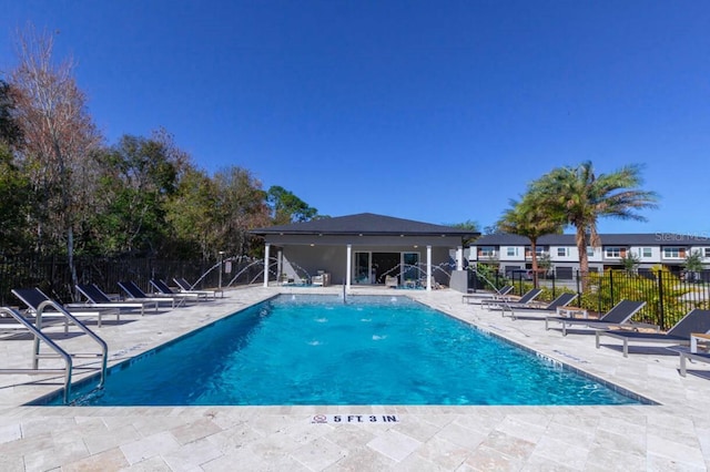 view of swimming pool with a patio area