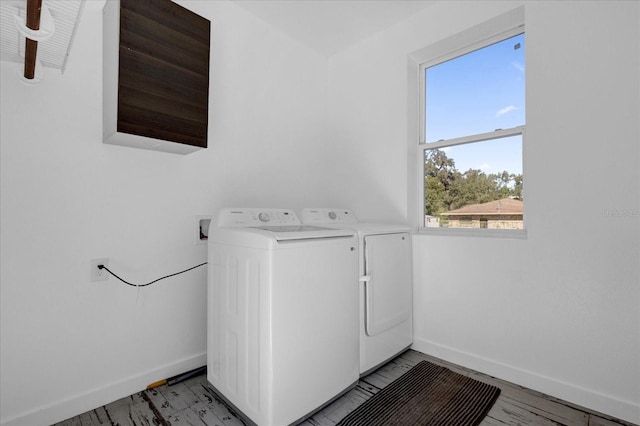 laundry area featuring a healthy amount of sunlight and independent washer and dryer