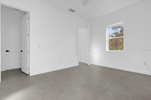 empty room with tile patterned flooring