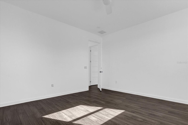 empty room with dark hardwood / wood-style floors