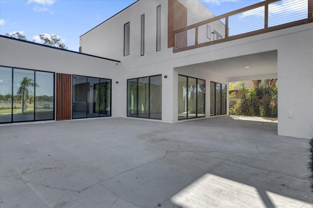 rear view of house with a patio