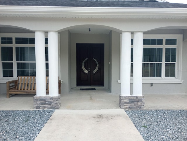 property entrance featuring covered porch