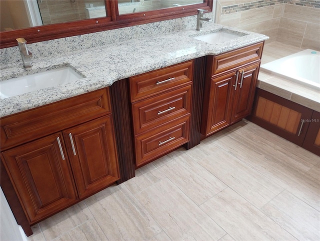 bathroom with a bathing tub and vanity