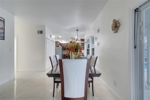 dining space with light tile patterned floors