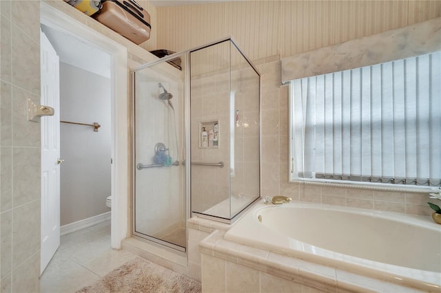 bathroom with tile patterned flooring, plus walk in shower, and toilet