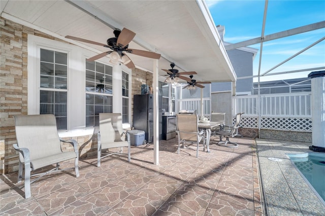 view of patio with a pool and a lanai